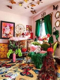 a living room filled with lots of colorful furniture and art on the wall above it