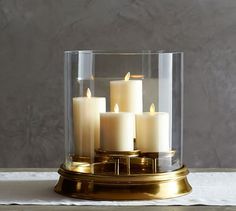 the website for pottery barn features candles in a glass container