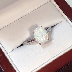 "White Lab created Opal  3.8 Carat Ring Handcrafted Indian jewelry. This is a beautiful lab created white fire Opal. Ring is in .925 Sterling Silver and finished with Rhodium EXCELLENT GIFT: for birthday, anniversary, holidays, stocking stuffers, graduation, Christmas, Valentine's Day, Mother's Day, Thank You or simply \"Thinking of You ALL RING SIZES AVAILABLE: We have our own manufacturing unit. We can deliver all custom ring sizes on request. CONTACT US: If you have any question, please post into \"Customer Questions & Answers\" below the \"Product specifications\".  Product colour may slightly vary due to photographic lighting sources or your monitor settings. Top Quality Craftsmanship Exceptional Styling ENTER OUR SHOP HERE for more fabulous jewelry :  https://www.etsy.com/in-en/shop/ Oval Opal Engagement Ring, Cheap Diamond Rings, Wood Gift Box, Opal Engagement Ring, White Opal Ring, White Lab, Opal Engagement, Engagement Rings Opal, Engagement Rings Oval