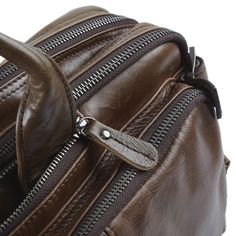 The Aztec is one of the most modern and versatile bags from Delton. The high-quality leather is tanned to a deep hazel brown gloss while retaining its natural, weathered look. The word "multifunctional" doesn't do this one justice. Wear it as a shoulder bag thanks to the sturdy, adjustable strap. To carry on your back, simply unzip and pull out the built-in straps. Finally, open the 2 side pockets, pull out the twin straps, and transport it by hand. This baby's the transformer of men's bags. The high-quality, durable buckles and heavy-duty metal zippers and clips ooze quality. But what about space? The main, sizable compartment accommodates your laptop and is loaded with extra pockets and storage options to separate all your items conveniently. This is a sturdy bag you can depend on throug Vintage Brown Leather Top Handle Bag, Vintage Brown Leather Bag With Top Handle, Classic Brown Leather Backpack With Zipper Closure, Modern Brown Leather Backpack, Modern Brown Leather Backpack For Everyday, Brown Soft Leather Shoulder Bag For Business Trips, Modern Brown Leather Backpack For Everyday Carry, Brown Leather Briefcase With Top Handle, Brown Soft Leather Satchel For Business Trips