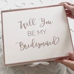 someone holding up a sign that says, will you be my bridesmaid?