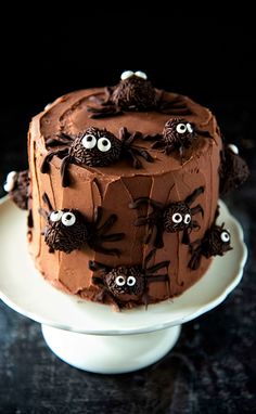 a cake decorated with chocolate frosting and spooky eyes is on a plate