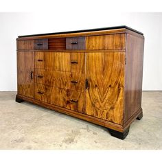 a large wooden dresser sitting on top of a floor