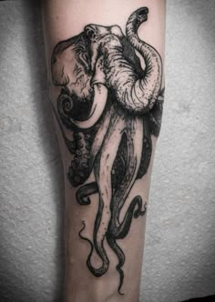 an octopus and squid tattoo on the leg