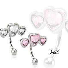 three heart shaped navel rings with pink crystal hearts on each side and two silver balls in the middle