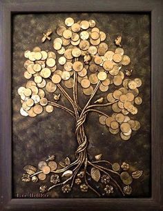 a tree made out of gold coins is shown in a framed frame on the wall