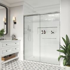 a bathroom with a sink, mirror and shower stall in the middle of the room