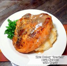 a white plate topped with chicken covered in gravy