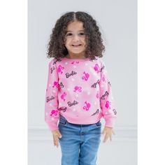 Your little girl is ready to play with her favorite dolls in this cute Barbie sweatshirt. This stylish pink pullover sweater features an all-over print of stars and the iconic Barbie logo and icon. Made of a soft material that keeps your little girl comfortable, this cozy Barbie sweatshirt is part of the perfect outfit for a fun day. BARBIE (R) and associated trademarks and trade dress are owned by, and used under license from, Mattel. (c) 2022 Mattel. Cute Pink Sweater With Cartoon Print, Pink Crew Neck Top With Star Print, Playful Pink Sweatshirt With Letter Print, Pink Cotton Sweatshirt, Pink Character Print Top For Winter, Pink Character Print Tops For Winter, Winter Pink Tops With Character Print, Pink Long Sleeve Sweater With Cartoon Print, Pink Long Sleeve Sweatshirt With Cartoon Print