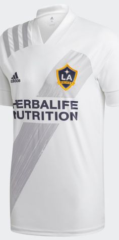 the new los galaxy home jersey is shown in white and grey, with black stripes on the chest