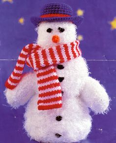 a stuffed snowman wearing a hat and scarf