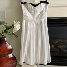 Nwot Jonathan Martin Silk Strapless A-Line Tea Length Dress In Ivory And Black Trim. Shell: 100% Silk Lining: 100% Poly White Knee-length Strapless Formal Dress, Chic White Lined Strapless Dress, Cream Strapless Evening Dress For Spring, Cream Strapless Dress For Spring Evening, White Strapless Dress With Lined Bodice For Cocktail, Formal White Strapless Dress With Lined Bodice, White A-line Strapless Dress With Lined Bodice, White Knee-length Strapless Dress For Formal Occasions, Silk Strapless Dress