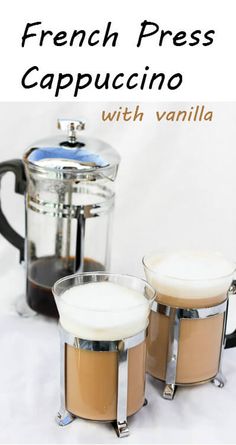 french press cappuccino with vanilla in the foreground and two espresso machines behind it