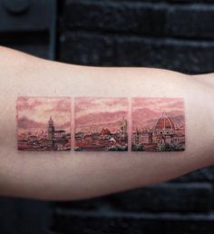 three pictures on the arm of a person with a cityscape behind them,