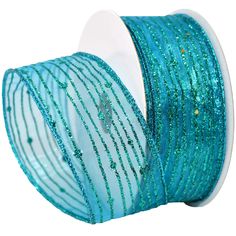 a roll of blue glitter ribbon on a white background