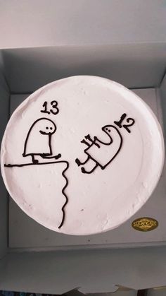 a white cake with black writing on it