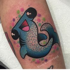 this is an image of a cartoon character tattoo on someone's leg