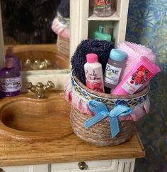 a basket filled with personal care items sitting on top of a wooden counter next to a bathroom sink