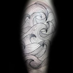 a man's arm with an abstract wave tattoo design on the left side of his leg