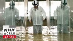 a man standing in the middle of a flooded room