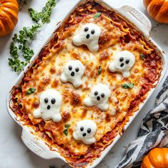 a casserole dish with four ghost faces on it