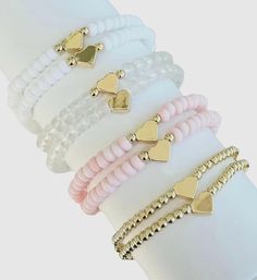 Mommy and Me matching Heart Bracelet Set.  🤍Mommy and me bracelets are sold as a set of 2.  HOW TO ORDER: 1) Select Bracelet Color  2) In PERSONALIZATION section:         🤍 Include both ADULT & CHILD bracelet sizes.  Every wrist measurement is different so please be sure to measure your child's wrist as well as yours. Please message me if you have any questions. I'm usually quick to respond.  👇🏻 👇🏻 👇🏻 📦📫FREE SHIPPING ON ALL DOMESTIC ORDERS OF $35 OR MORE! 📌Care:  * Keep bracelets dry and away from chemicals, soaps, sweat and water to keep in the best condition. * Roll bracelet on instead of stretching over hand. Bracelets may break with excessive over-stretching. 📌Since each bracelet is made to order, all sales are final and we do not accept returns. If you have any issues with Matching Heart Bracelet, Keep Bracelet, Name Bracelets, Mini Bracelet, Moms Bracelet, Christmas Gift For Mom, Matching Jewelry, Jewelry Christmas, Stretchy Bracelets