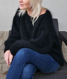 "Hand knit mohair sweater for cozy evenings. It is wonderful for cold season. It is loose knitted and fluffy The material of this sweater is mix of 50% mohair and 50% polyester. Color - black. The mohair has a beautiful long fiber which gives the sweater a soft and luxurious look. The sleeves of this sweater have a loose wide fit, the sleeves are long. On a photo sweater in black (15) color Length 23\" for XS-S, 24\" for M - L,24\" for XL The same sweater in white https://www.etsy.com/listing/74 Black Alpaca Sweater For Fall, Cozy Black Mohair Sweater, Fall Black Alpaca Sweater, Black Mohair Winter Sweater, Black Mohair Sweater For Winter, Oversized Hand Knitted Black Sweater, Black Oversized Hand Knitted Sweater, Black Mohair Long Sleeve Sweater, Black Long Sleeve Mohair Sweater