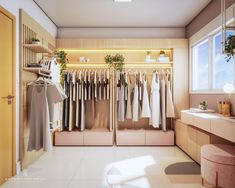 a room that has some clothes hanging on the racks in front of it and a window