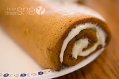 the best pumpkin roll recipe ever on a plate with text overlay that reads, how does she cook?