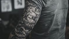 Detailed sleeve tattoo with intricate black and gray designs, showcasing the artistry of a skilled tattoo artist. A Sleeve Tattoo, Gray Shades, Tattoo Artwork, Gray Design, Black And Gray