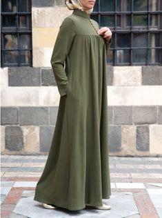 Muhibba Abaya Long Abaya With Pockets, Long Maxi Dress For Daywear, Solid Long Maxi Dress For Daywear, Solid Color Long Maxi Dress For Daywear, Green Long Sleeve Maxi Dress With Side Slits, Modest Long Plain Abaya, Long Dress With Modesty Panel, Modest Long Plain Dresses, Elegant Long Maxi Dress With Pockets