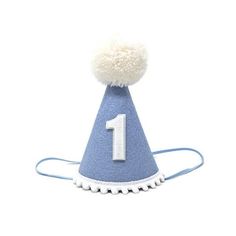 Small (Mini)  or Large  New Blue Felt Hat, White yarn pom, White pom trim, with or without White Glitter number backed in White.  Both Small (Mini) and Large hats fit all ages. We offer two sizes for your preference.    Our party hats and crowns are attached to a comfortable elastic and meant to be worn around the back of the head, behind the ears. Tilt to the side for a fun, whimsical look! LITTLE BLUE OLIVE SHOP CROWNS and HATS are the perfect accessory for birthday celebrations, memorable pho Felt Party Hat, Hat Birthday Party, Blue Birthday Party, Boys First Birthday, Blue Birthday Parties, Birthday Party Hats, Large Hats, Blue Birthday, Blue Party