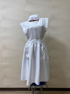 Nurse costume Women costume Nurse uniform Nurse cap  Nurse White cap Haloween costume Cosplay costume women Ratched costume Dolly costume We can do any size. We can do any color. Please message me whith any additional questions and I will be happy to accomadate Your needs. To ensure the correct fit of the dress, send me please the following measurements: - height, - waist circumference, - chest circumference, - shoulder circumference, - hip circumference, - biceps circumference, - length of sleeves, - necessary length of dress. Back to my MustHaveCo shop: https://www.etsy.com/shop/MustHaveCo?ref=seller-platform-mcnav Ratched Costume, Nurse Costume Women, Costume Nurse, Nurse Cap, Women Costume, Nurse Costume, Costume Women, Nursing Cap, Nurse Uniform