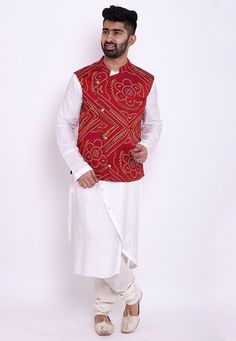 Readymade Art Silk Asymmetric Kurta in White. This Collar Neck and Full Sleeve attire is Prettified with Buttons, Zipper, Bandhej Print and has One Welt Pocket, One Inside Pocket and Two Side Pockets. Available with a White Cotton Churidar and a Red Faux Crepe Nehru Jacket. Do note: Footwear shown in the image is for presentation purposes only. Half to one inch may vary in measurement. (Slight variation in actual color vs. image is possible). We sell all kinds of menswear. Mens Kurta | Mens Kurt Red Wedding Kurta For Spring, Traditional Red Nehru Jacket With Long Sleeves, Red Long Sleeve Nehru Jacket For Festivals, Fitted Red Nehru Jacket For Festivals, Red Fitted Nehru Jacket For Festivals, Red Nehru Jacket For Festive Winter Occasions, Red Festive Nehru Jacket For Winter, Red Festive Winter Kurta, Red Winter Festive Kurta