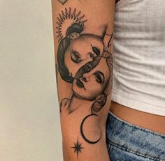 a woman with a sun and moon tattoo on her arm