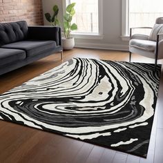 a black and white area rug in a living room