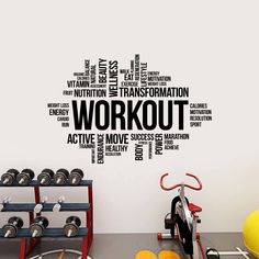 a wall decal that says workout in different languages on the side of a gym room