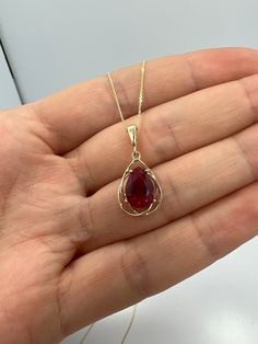 This is a beautiful pear teardrop pendant design. It is set in real solid 14Kt Gold and the chain is 14Kt Gold as well.  I have this pendant available with all gemstones that you can see in my store. You can choose if you want 14Kt White Gold, 14Kt Yellow Gold or 14Kt Rose Gold.  This is the perfect gift for mom, wife, fiancee, girlfriend, valentine, daughter, family or friend. It is a special gift for mother's day, valentine's day, wedding, anniversary, birthday, Christmas, Easter, New Year's a Ruby Locket Designs, Gemstone Pendant Design, Yellow Gold Teardrop Gemstone Drop Necklace, Pear-shaped Gemstone Drop Necklace In Yellow Gold, Yellow Gold Pear-shaped Gemstone Drop Necklace, Pear-shaped Birthstone Drop Necklace, Pendant Gold Design, Ruby Jewelry Necklaces Gold, Red Gold Jewelry