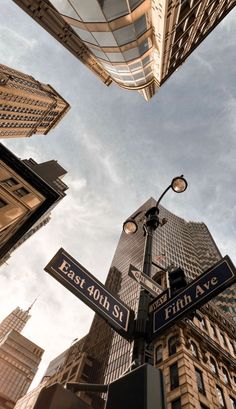 the street signs are clearly visible for all of us to see in this cityscape