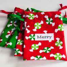 two red and green christmas wrappings with the word merry on them, sitting next to each other