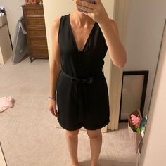 Nwt Cute Black Romper By Express! Cute Button Detailing On The Front With Pockets And Detachable Black Belt! This Romper Can Easily Be Dressed Up With Cute Heels Or Wedges Or Dressed Down Casual Sneakers! Black Button-up Jumpsuits And Rompers, Black Button-up Jumpsuit For Work, Chic Black Jumpsuits And Rompers With Buttons, Chambray Jumpsuit, Short Sleeve Jumpsuits, Cute Heels, Red Jumpsuit, Striped Rompers, White Bodysuit