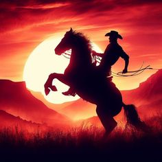 the silhouette of a cowboy riding a horse in front of an orange and red sunset