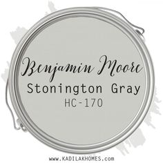 a white round sign with the words benjam moore and stonnington gray