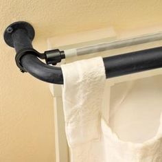 an image of a toilet paper roll hanging on a towel rack with the caption, instantly hang a second panel behind existing