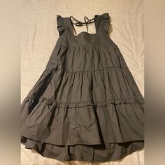 Black, Size Small, Never Worn, Still Has Tags Black A-line Sundress For The Beach, Black Ruffled Sundress For Spring, Black Sundress For Day Out, Chic Black Sundress For Spring, Chic Black Sundress For Casual Wear, Black Mini Sundress With Ruffles, Black Ruffled Mini Sundress, Chic Black Sundress For Day Out, Spring Black Cotton Mini Dress