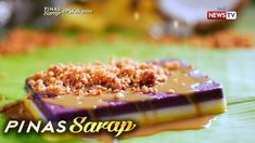 a close up of a piece of food on a plate with the words pinas saray