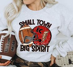 Small Town Big Spirit Football Shirt, Red and Black Football Team Shirt, Football Mom Shirt, Custom Football Shirt, Football Spirit Shirt Unisex Fit Tee (Shown in Ash) Bella brand. DTF All materials used are high quality, professional grade. Please check shop updates for current turnaround times! Football Spirit Wear Ideas, High School Cheer Shirts Design, Football Championship Shirt Ideas, High School Football Shirts Design, Red Team Spirit Tops For Fall, High School Football Game Outfit Mom, Red T-shirt For School Spirit In Fall, Red Casual Shirt For Game Day, Casual Red Shirt For Game Day