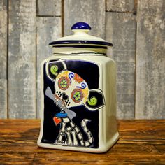 a ceramic jar with a design on it