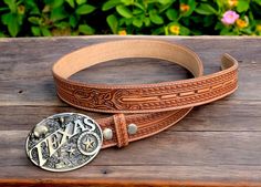 Texas, tooled and engraved embossed buckle Beautifully handmade western cowboy leather belt for men One-piece full grain genuine cowhide leather Western cowboy leather belt for men with a rodeo tooled buckle 1-1/2" Wide (38 millimeters wide) Handmade, tooled and embossed floral design The belt comes with a buckle, however the snap-on system allows you to customize the look of the belt with your own buckle of preference. Returns within 30 days of receiving Texas American belt buckle buckle Handcr Engraved Western Belt Buckles For Western-themed Events, Engraved Western Belt For Ranch, Adjustable Engraved Belt Buckles For Western-themed Events, Western Engraved Adjustable Belt, Western Style Engraved Belt For Ranch, Western Adjustable Engraved Belts, Western Style Engraved Adjustable Belts, Western Style Adjustable Engraved Belts, Engraved Brown Belt Buckles For Western-themed Events