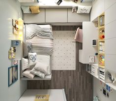 a small bedroom with white walls and wood flooring is shown in this aerial view